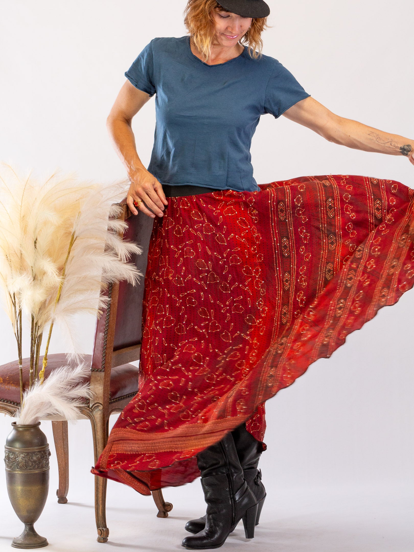 A full circle silk skirt made from vintage sari's in a mulberry shade with hand-stitching and sequins