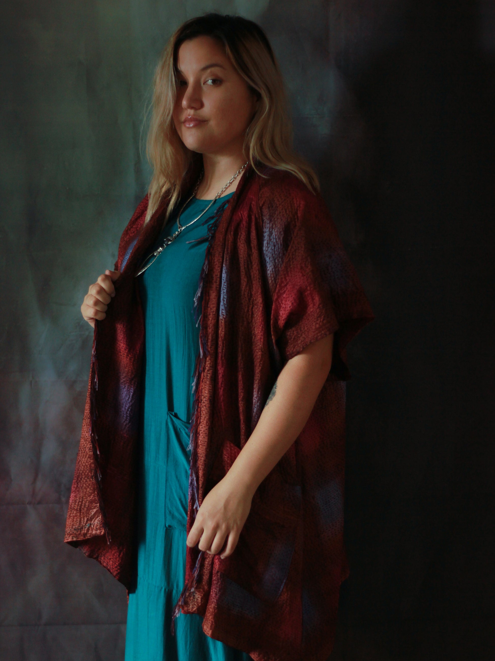 Woman wearing a purple and maroon kimono